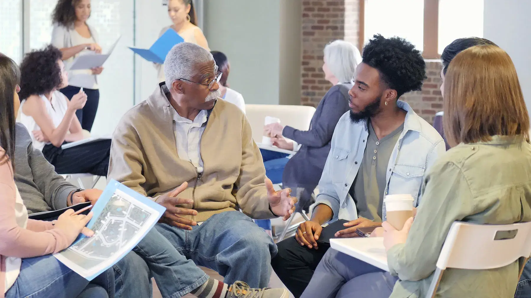 Two men conversing while seated